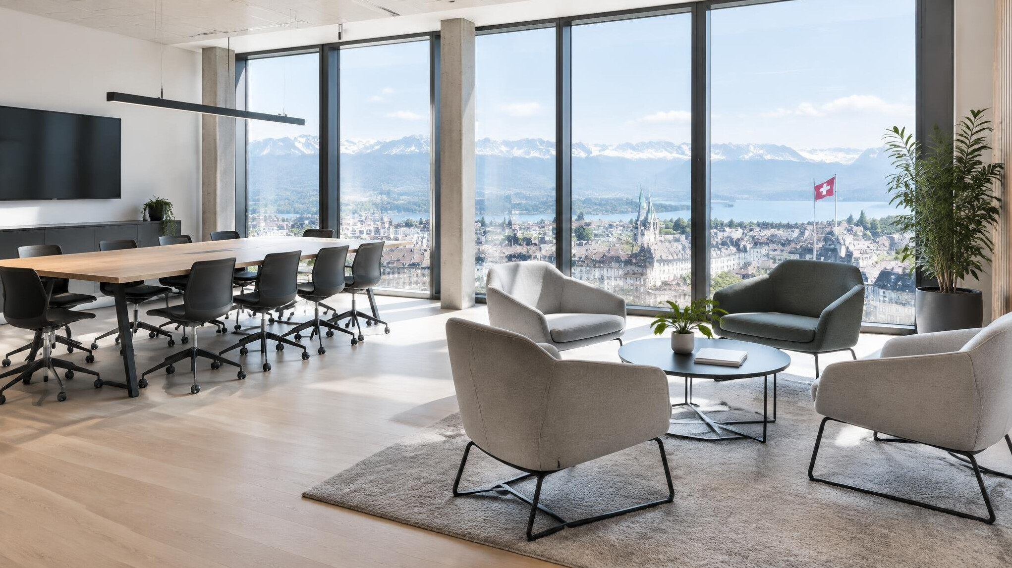 Bright modern Swiss office meeting space with seating area