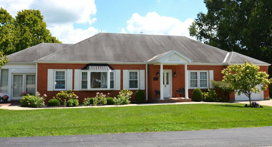 modern house with insurance documents